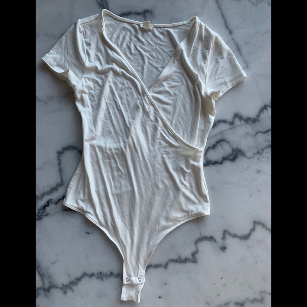 Brand new white body suit from garage!
